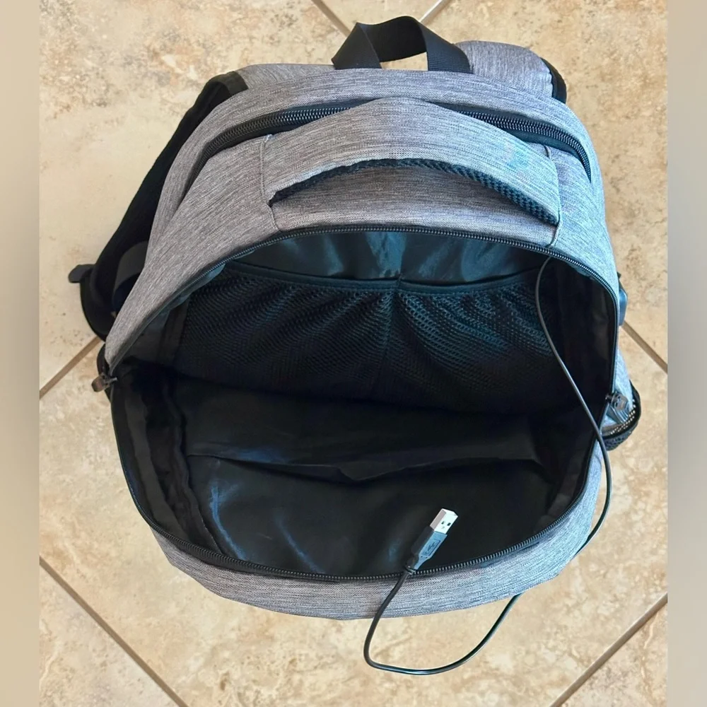 Backpack Excellent condition! Lots of zip compartments. Grey black. Clean!